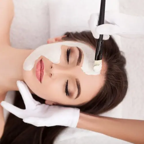 Bride relaxing with a face mask applied during her day at the spa.