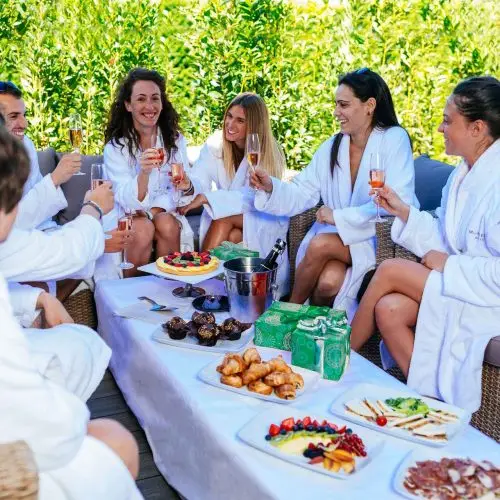 Friends celebrate birthday with champagne and brunch